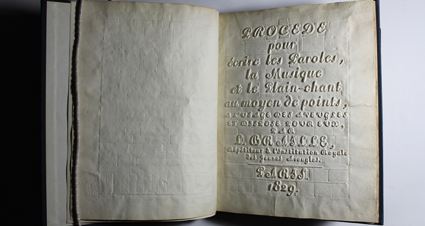 Image of the cover page of a book with raised text, so that a blind person could feel the indentations of the text. It reads: "Procede pour écrire les Paroles, la Musique et le Plain-chant au moyen de points, a l'usage des avegles et assxose pour eux, Per L. Braille, Répétiteur a l'Institution Royale des Jeunes Aveugles. PARIS. 1829