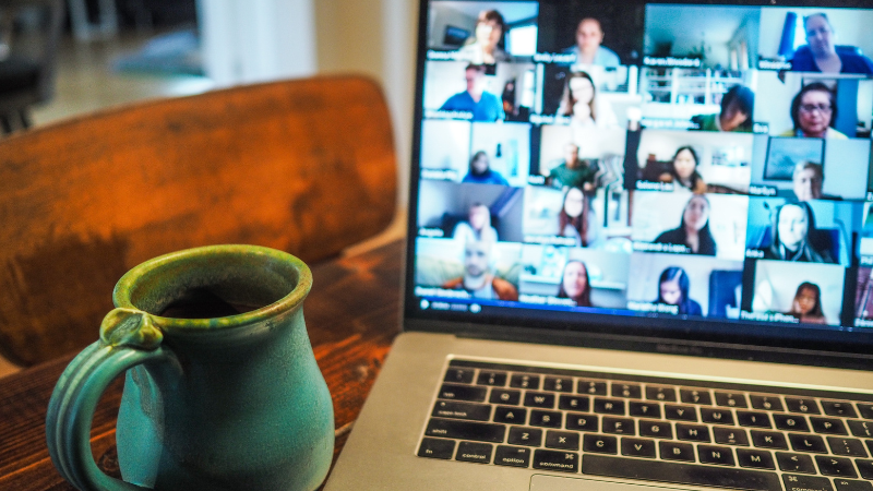 image of mug next to computer open to a zoom meeting